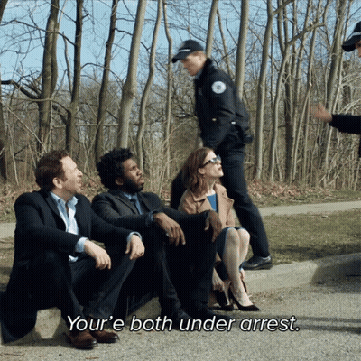 People Sitting on Road One Says Youre Both Under Arrest