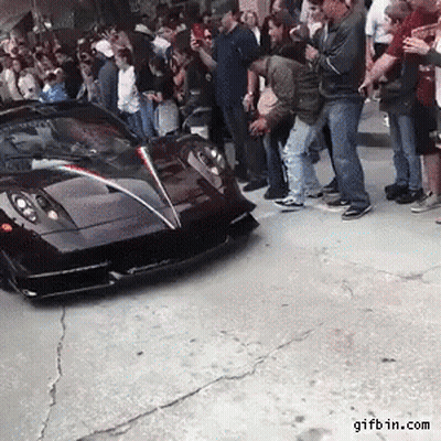 People Standing Around Black Sports Car With Gifbin.com GIF