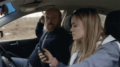 People Standing Around Overturned Car GIF