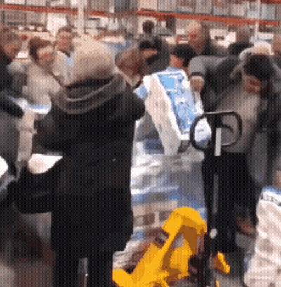People Standing Around Yellow Pallet Truck GIF