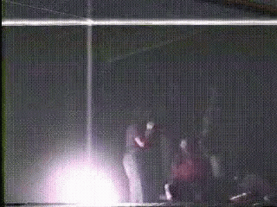 People Standing In Dark Room GIF