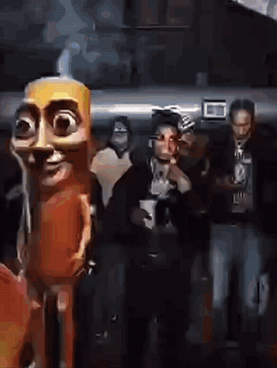 People Standing In Dark Room With Cartoon Character GIF