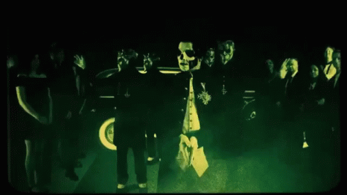 People Standing In Dark Room With Green Light GIF