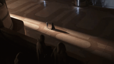 People Standing In Dark Room With Shadow GIF
