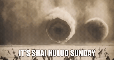 People Standing In Desert Facing Giant Worm GIF