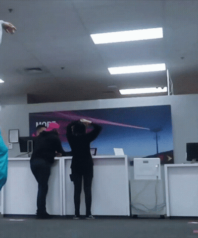 People Standing In Front Of A Sign That Says Hop GIF