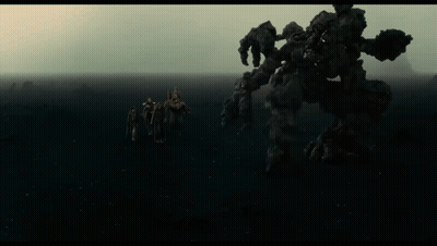 People Standing In Front Of Monster GIF