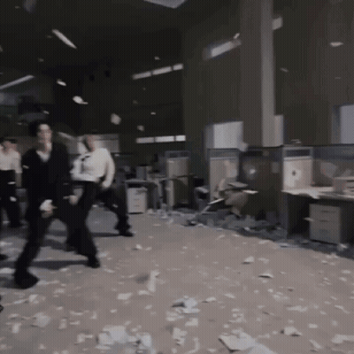 People Standing In Messy Office GIF