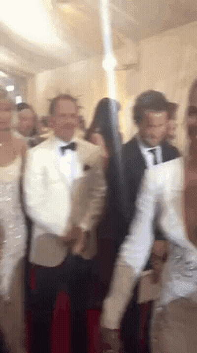 People Standing In Room With Gun GIF