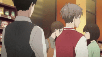 People Standing In Store With Red Jacket GIF