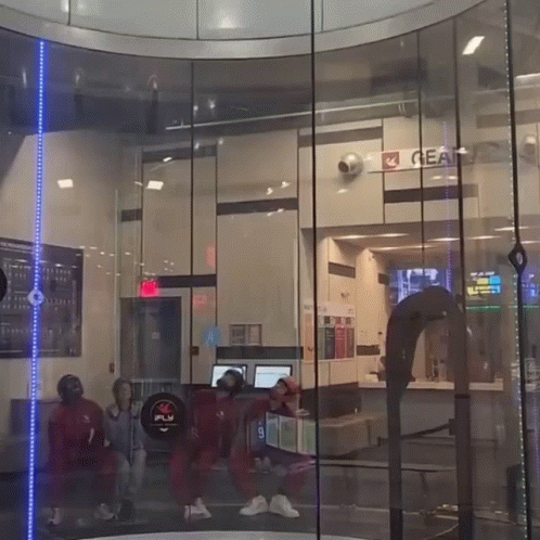 People Standing Next To Gear Sign GIF