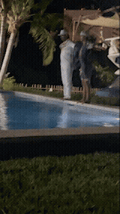 People Standing Next To Pool GIF