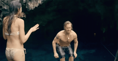 People Swimming In Lake With Red Bull Sign GIF
