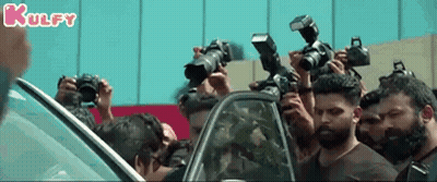 People Taking Photos Of Man By Car GIF