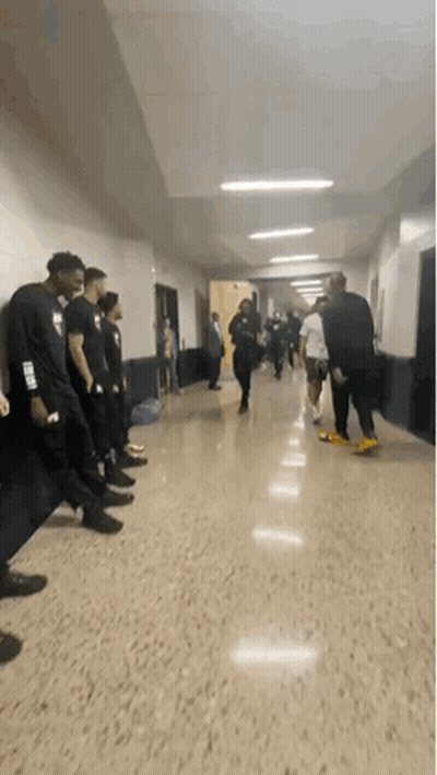People Talking In Hallway GIF
