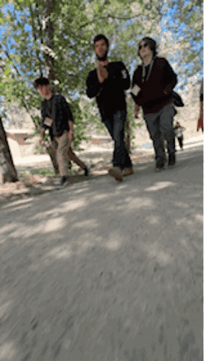 People Walking Down Dirt Road GIF