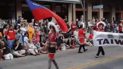People Walking Holding Banner Saying Taiw GIF