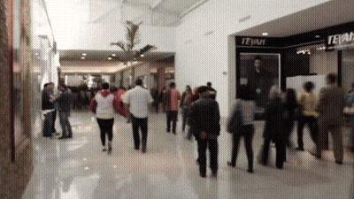 People Walking In Mall With Tejani Store GIF
