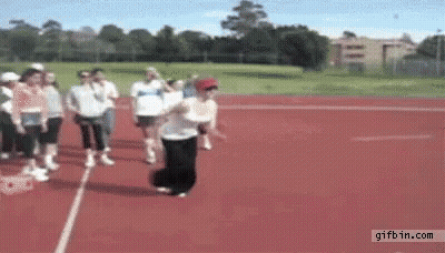 People Walking On Red Track One Jumping GIF