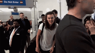 People Walking Past Do Not Enter Sign GIF