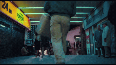 People Walking Past Government Store GIF