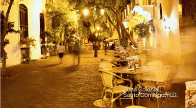 People Walking Zona Colonial Sign GIF