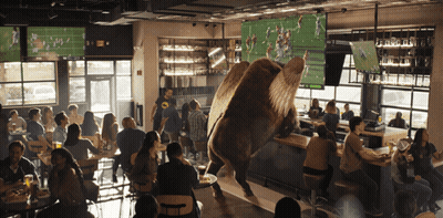 People Watching Football In Restaurant GIF
