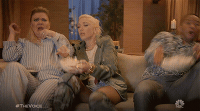 People Watching The Voice And Eating Popcorn GIF