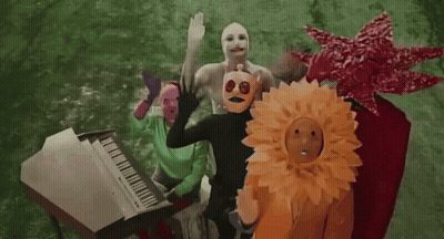 People Wearing Masks Around White Piano GIF