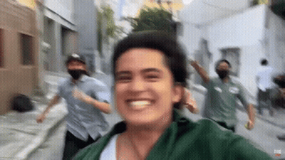 People Wearing Masks Running And Taking Selfie GIF