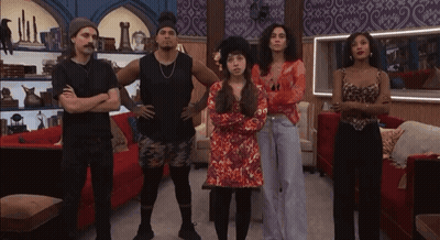 People With Arms Crossed In Living Room GIF