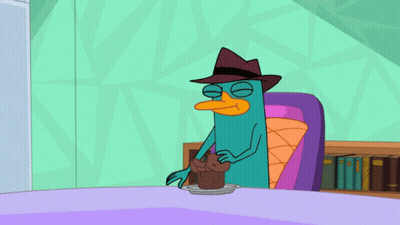 Perry The Platypus Sitting At Table GIF