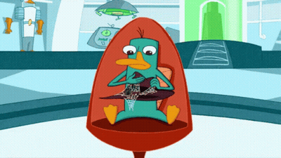 Perry The Platypus Sitting In A Chair GIF