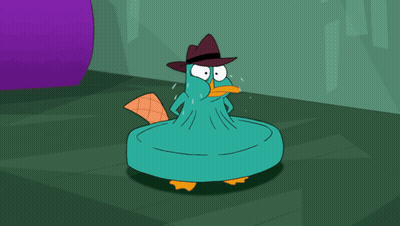 Perry The Platypus Sitting In Chair With Pillow GIF