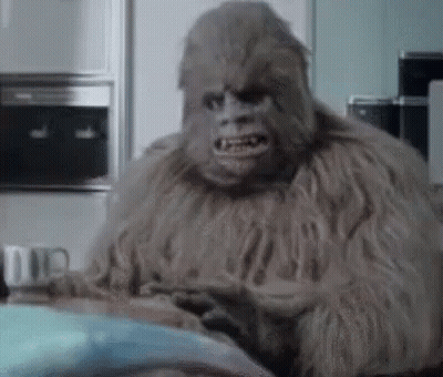 Person As Bigfoot On Kitchen Couch GIF