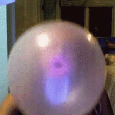 Person Blowing Purple Light Bubble GIF