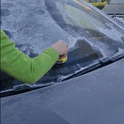 Person Cleaning Car Windshield With Yellow Tool GIF