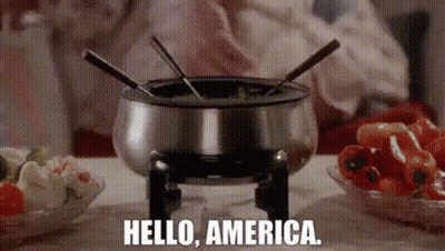 Person Cooking Fondue Saying Hello America GIF