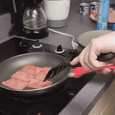 Person Cooking Ham In Frying Pan On Stove GIF