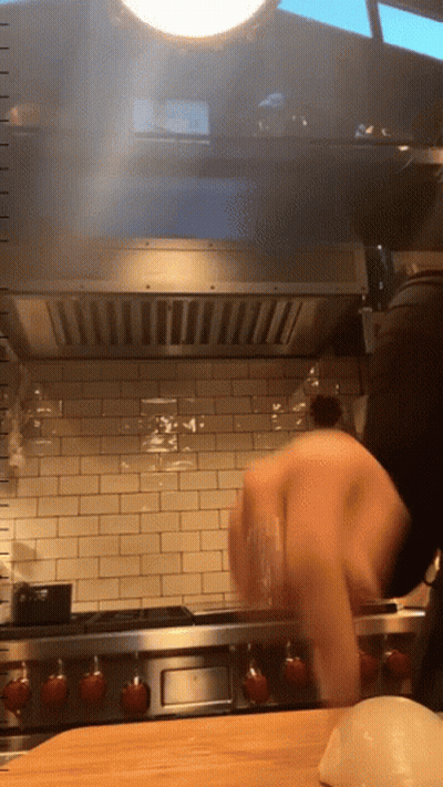 Person Cooking on Wolf Stove