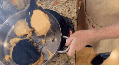 Person Cooking Pancakes On Stove Top GIF