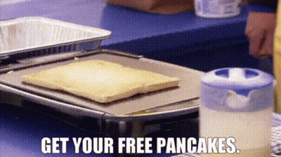Person Cooking Pancakes Saying Get Your Free Pancakes GIF