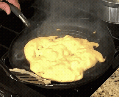 Person Cooking Scrambled Eggs GIF