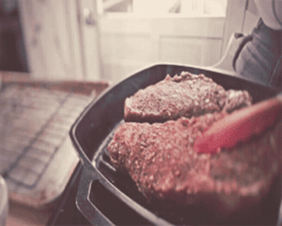 Person Cooking Steak In Pan GIF