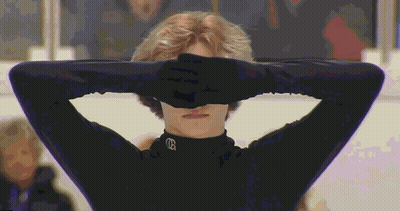 Person Covering Eyes In Black Shirt With Letter G GIF