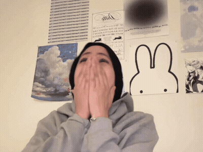 Person Covering Mouth In Front Of Bunny Poster GIF