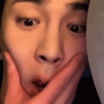 Person Covering Mouth With Finger GIF