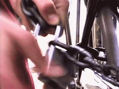 Person Cutting Bike Chain GIF