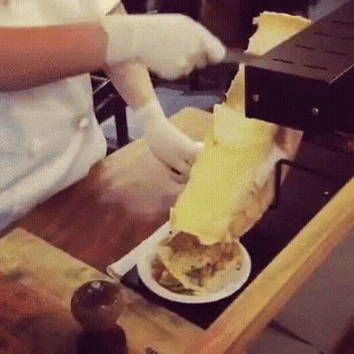 Person Cutting Food On Plate GIF