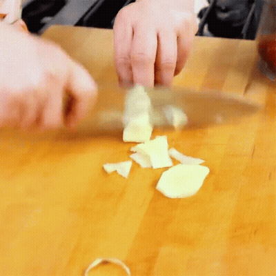 Person Cutting Garlic GIF